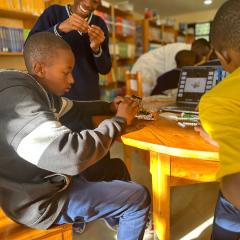 Students at Groupe Scolaire Kacyiru II assembling mission models